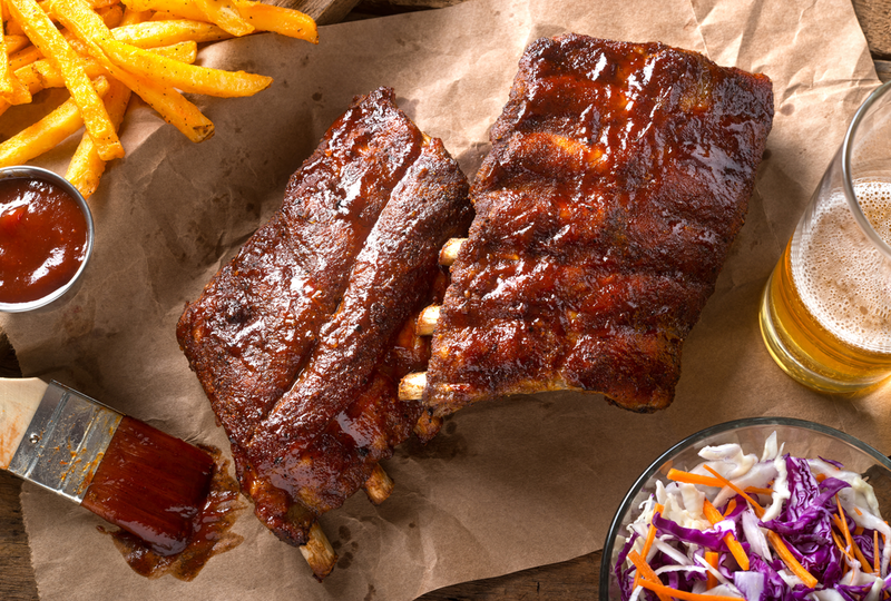 bbq ribs with coleslaw, fries, and beer